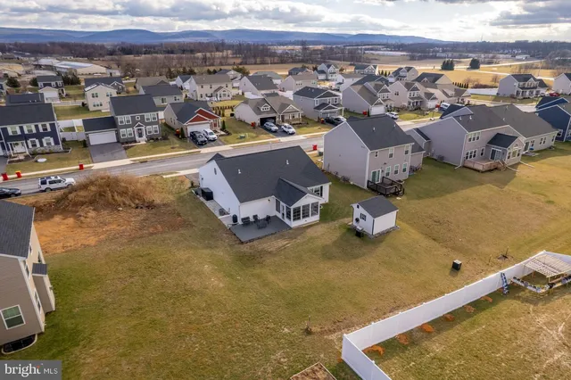 an aerial view of a house with swimming pool