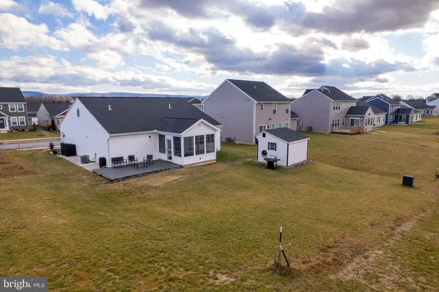 a view of a big house with a yard