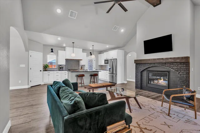 a living room with furniture and a fireplace