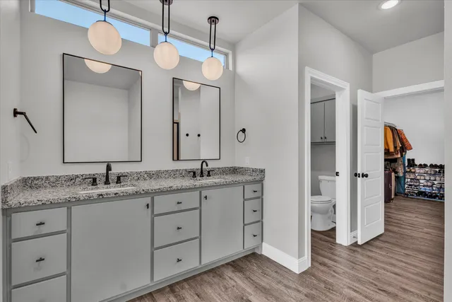 a large bathroom with a double vanity sink and a mirror