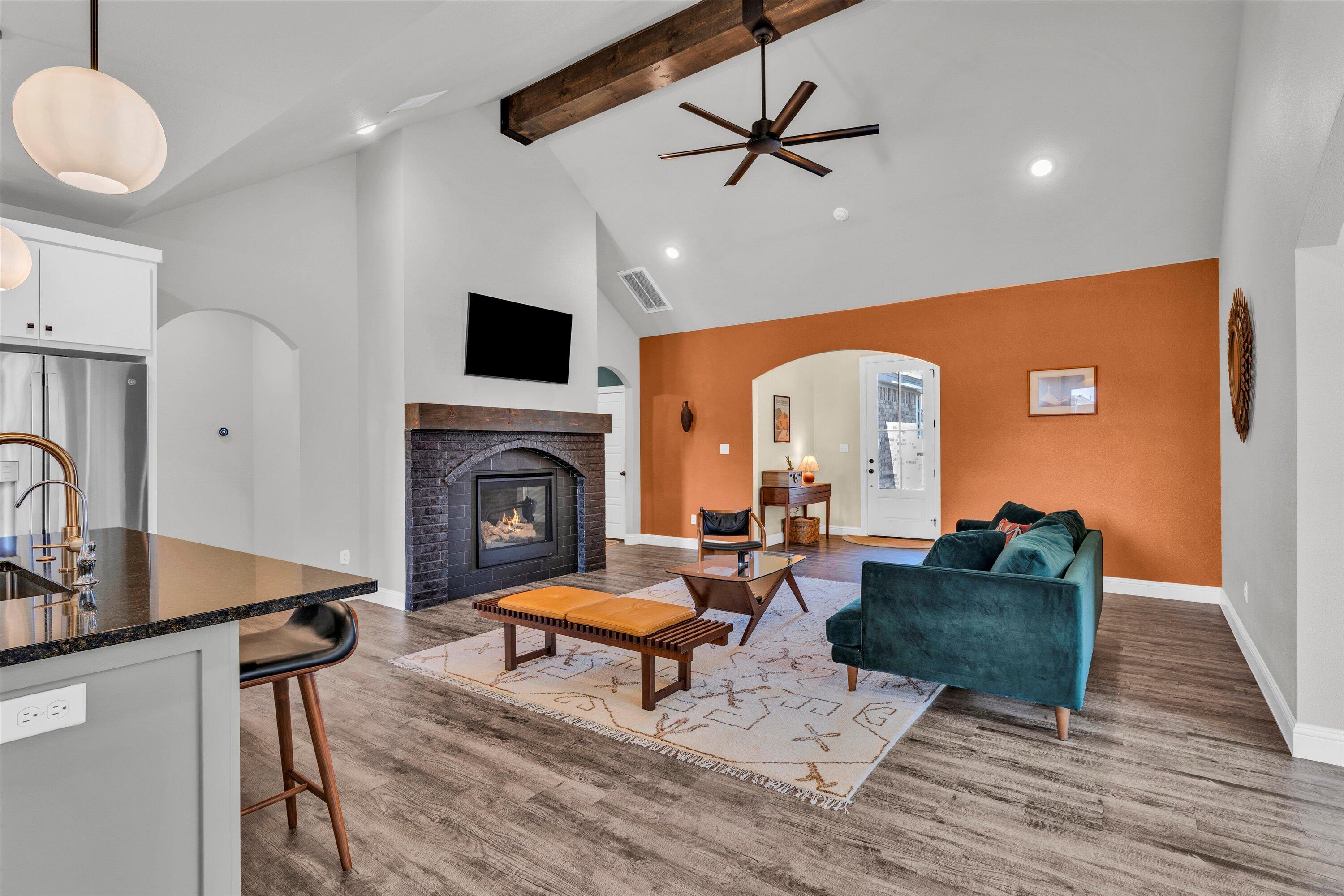 6803 52nd Street Lubbock, TX 79407 - Photo 2 of 34 a living room with furniture and a fireplace