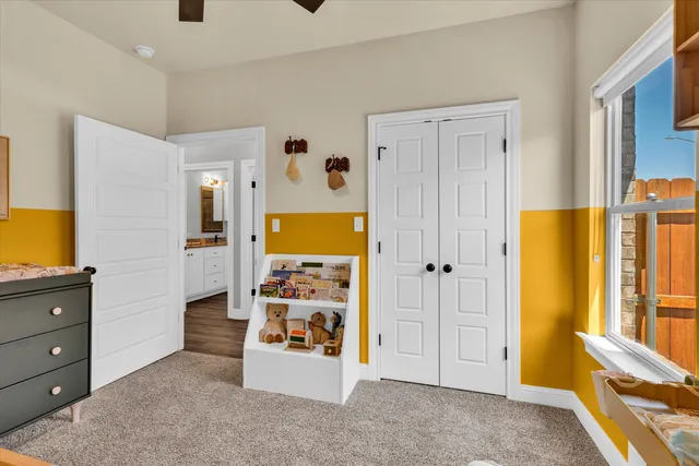 a view of a livingroom with wooden floor and cabinet