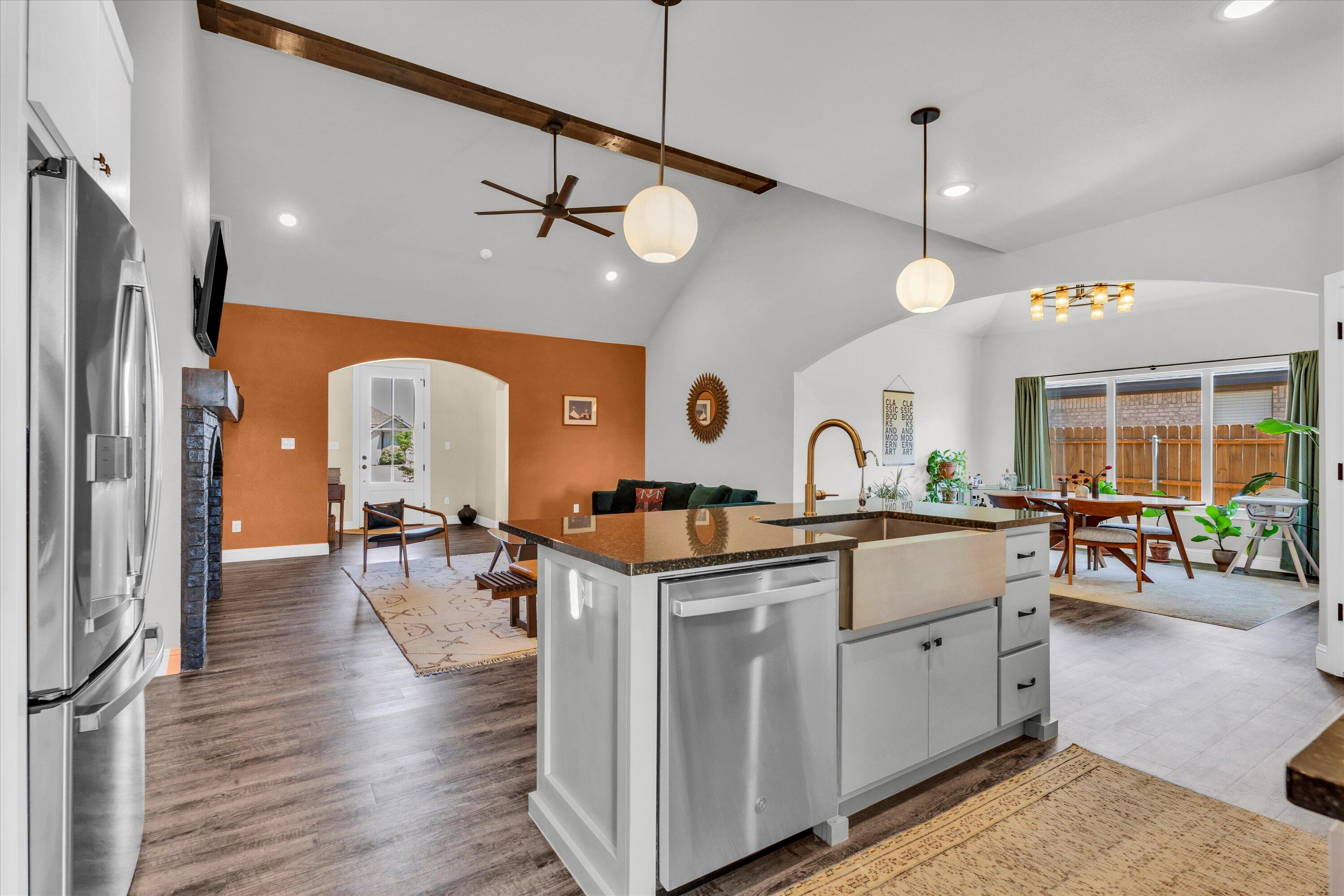 6803 52nd Street Lubbock, TX 79407 - Photo 3 of 34 a kitchen with stainless steel appliances granite countertop a stove and a refrigerator