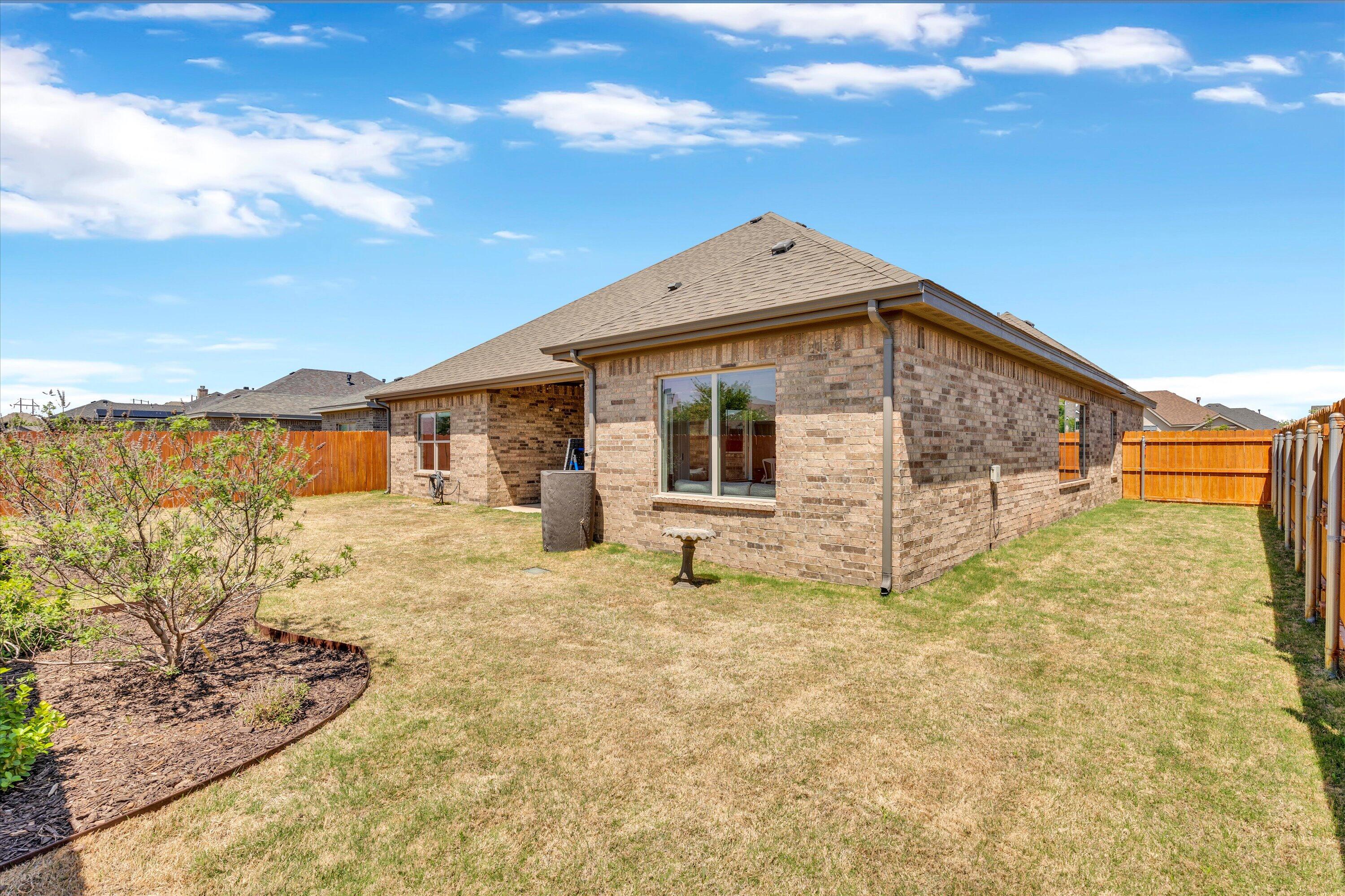 6803 52nd Street Lubbock, TX 79407 - Photo 34 of 34 a view of a house with backyard