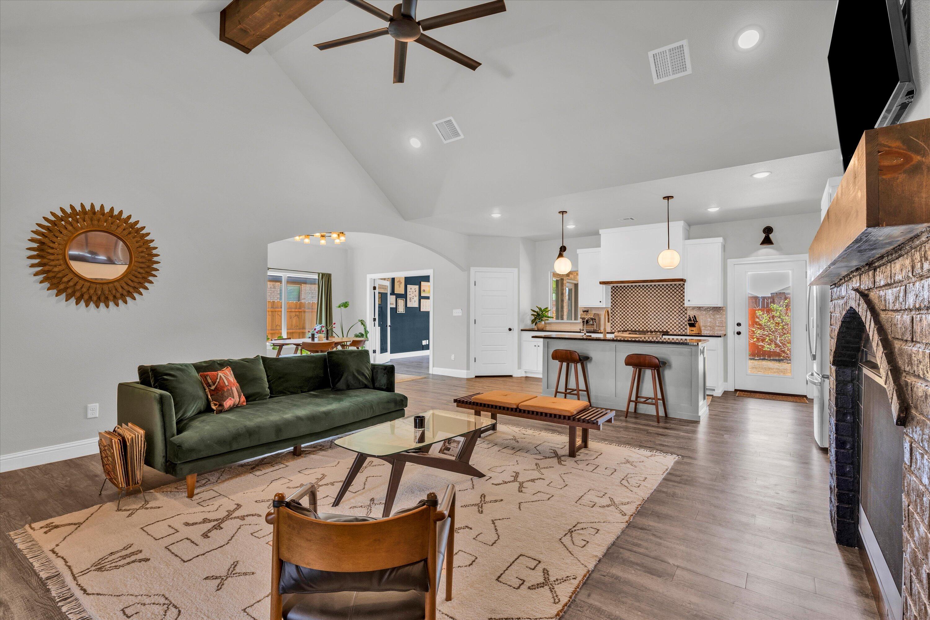 6803 52nd Street Lubbock, TX 79407 - Photo 5 of 34 a living room with furniture and kitchen view