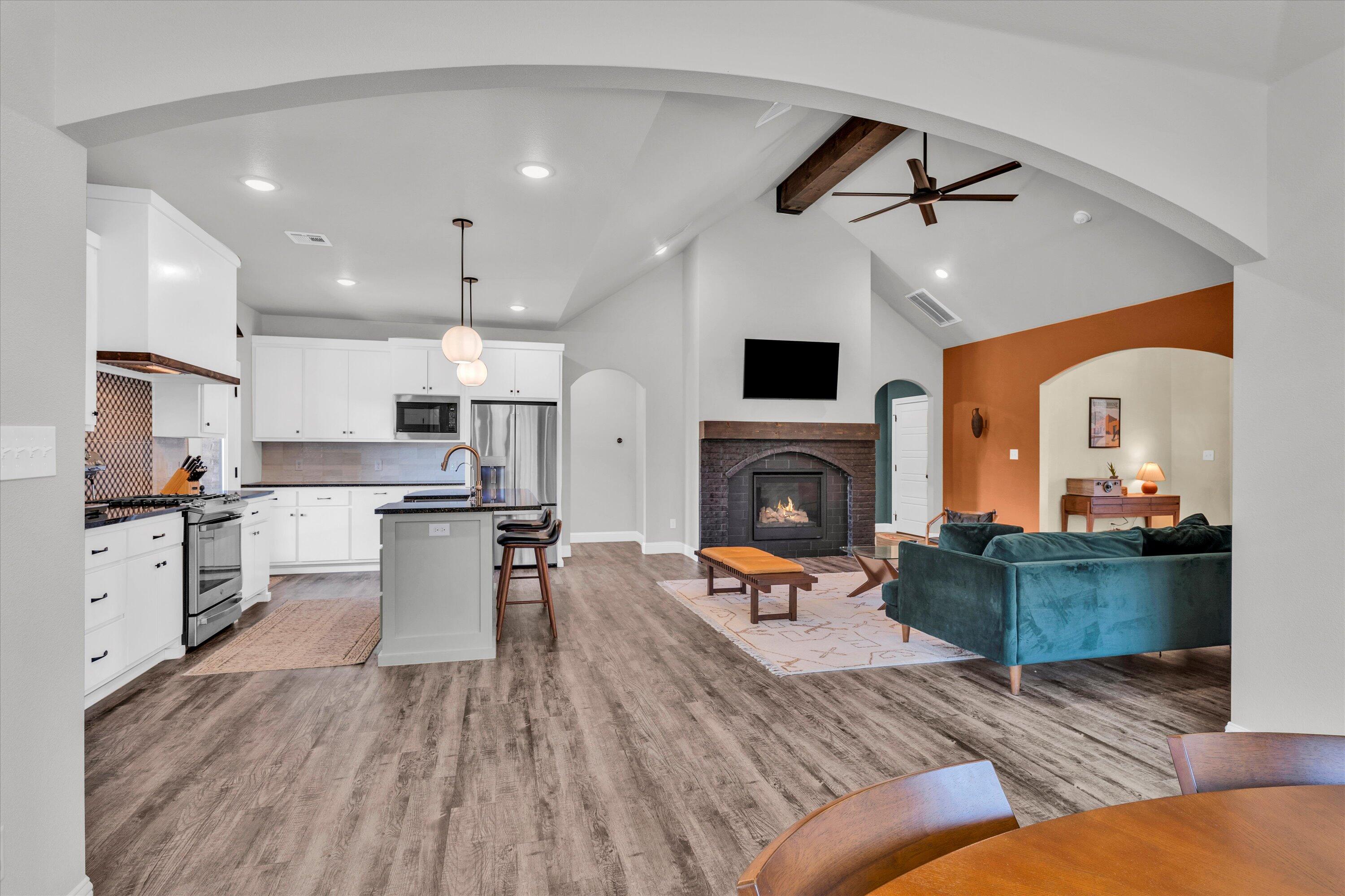 6803 52nd Street Lubbock, TX 79407 - Photo 6 of 34 a living room with furniture and a fireplace