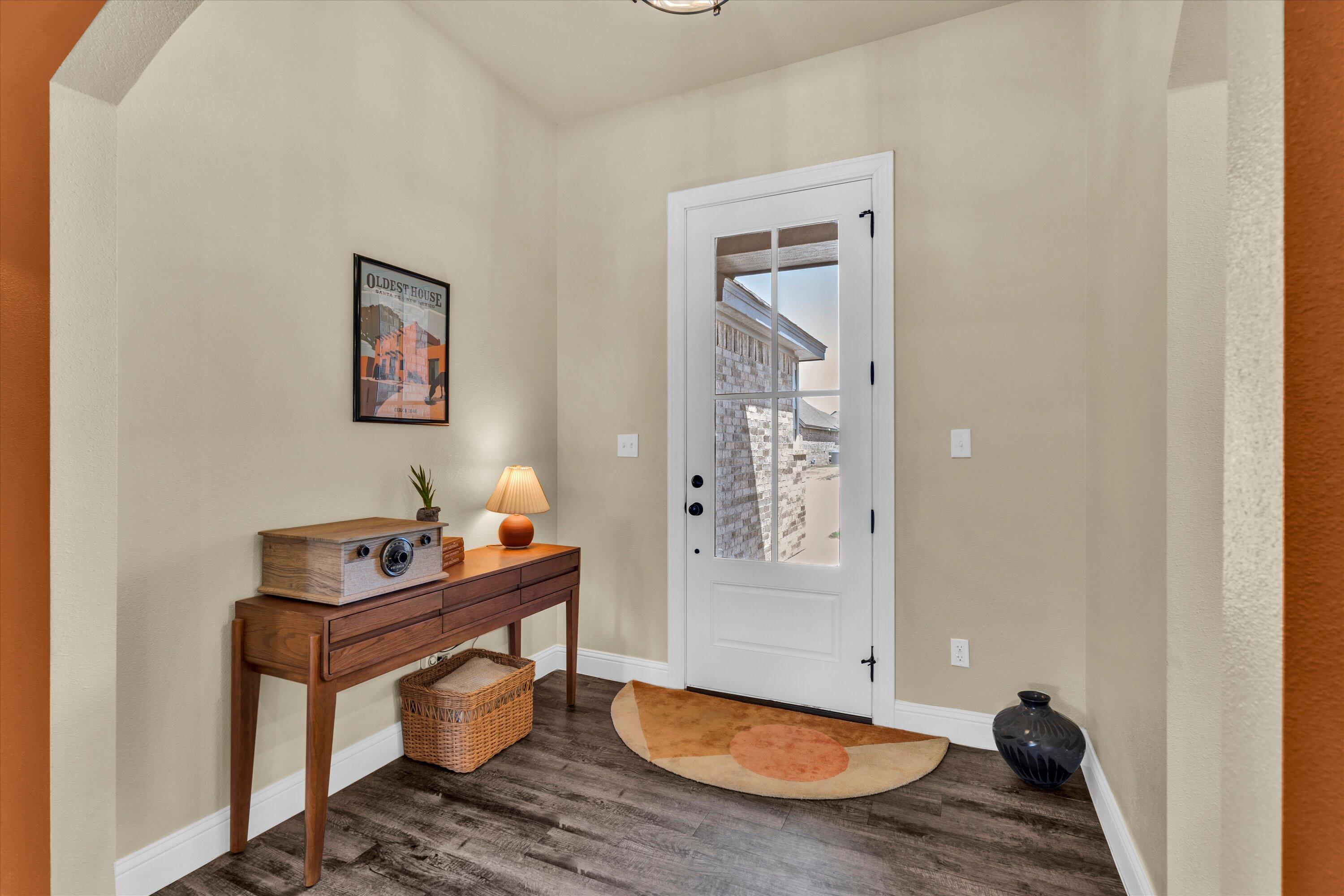 6803 52nd Street Lubbock, TX 79407 - Photo 7 of 34 a view of a workspace with furniture and a window