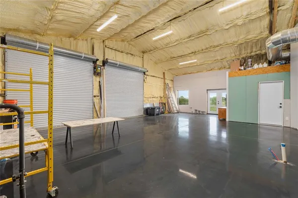 a view of a hall with wooden floor