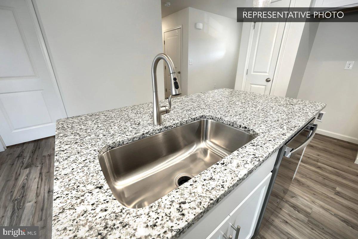 Sugar Maple Plan At Hills Spring Grove, PA 17362 - Photo 15 of 34 a kitchen with a sink and a refrigerator