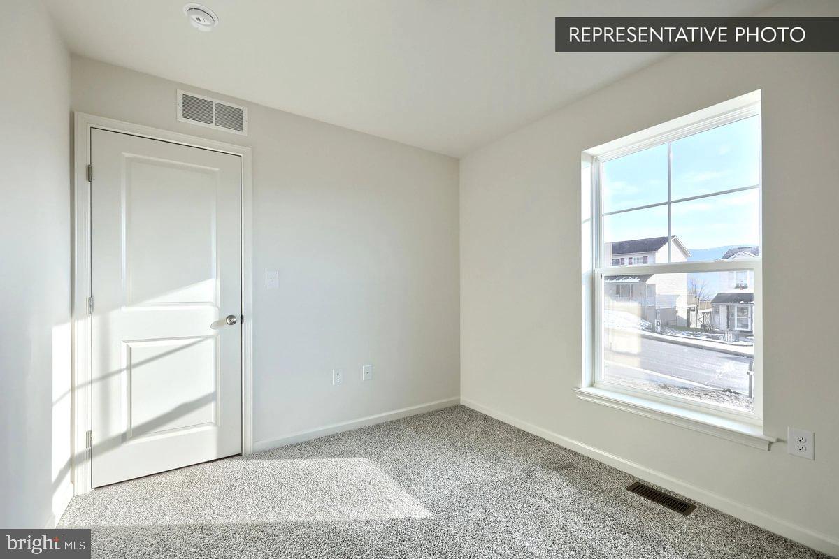 Sugar Maple Plan At Hills Spring Grove, PA 17362 - Photo 9 of 34 a view of an empty room with a window