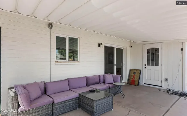a living room with furniture and a window