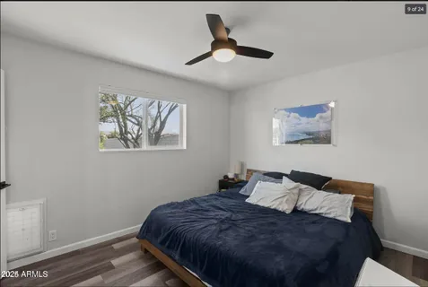 a bed room with a bed and a painting