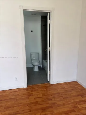 a view of a bathroom with a toilet