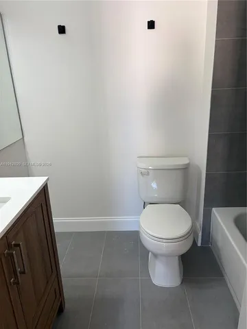 a bathroom with a toilet and a sink