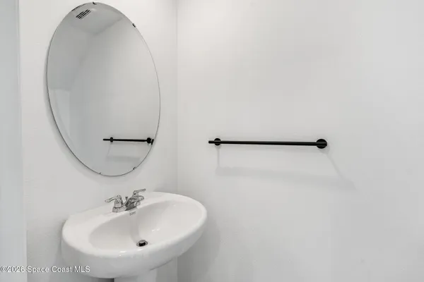 a bathroom with a sink and mirror