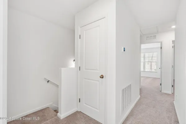 a view of a hallway with two rooms