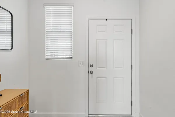 a view of a room that has a window in it