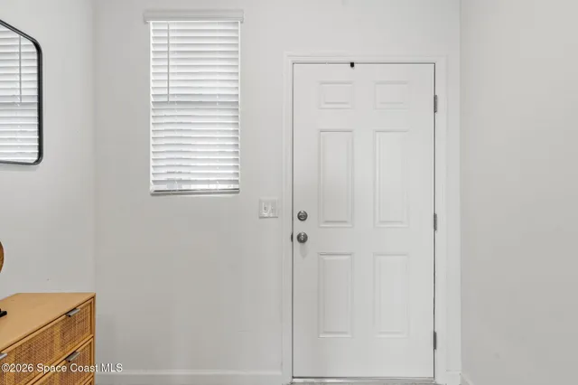 a view of a room that has a window in it