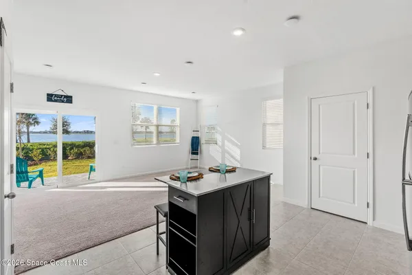 a kitchen that has a lot of cabinets in it
