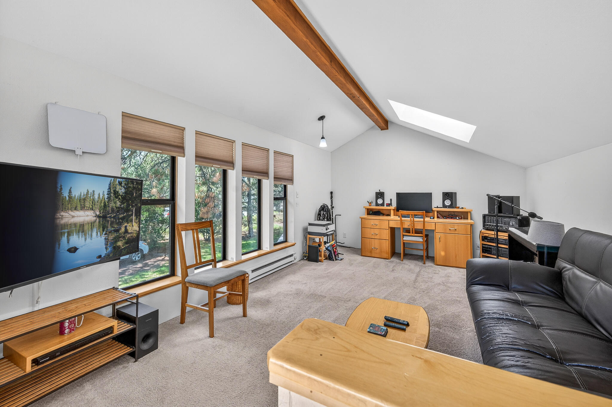60866 Brosterhous Road Bend, OR 97702 - Photo 36 of 41 a living room with furniture kitchen view and large windows