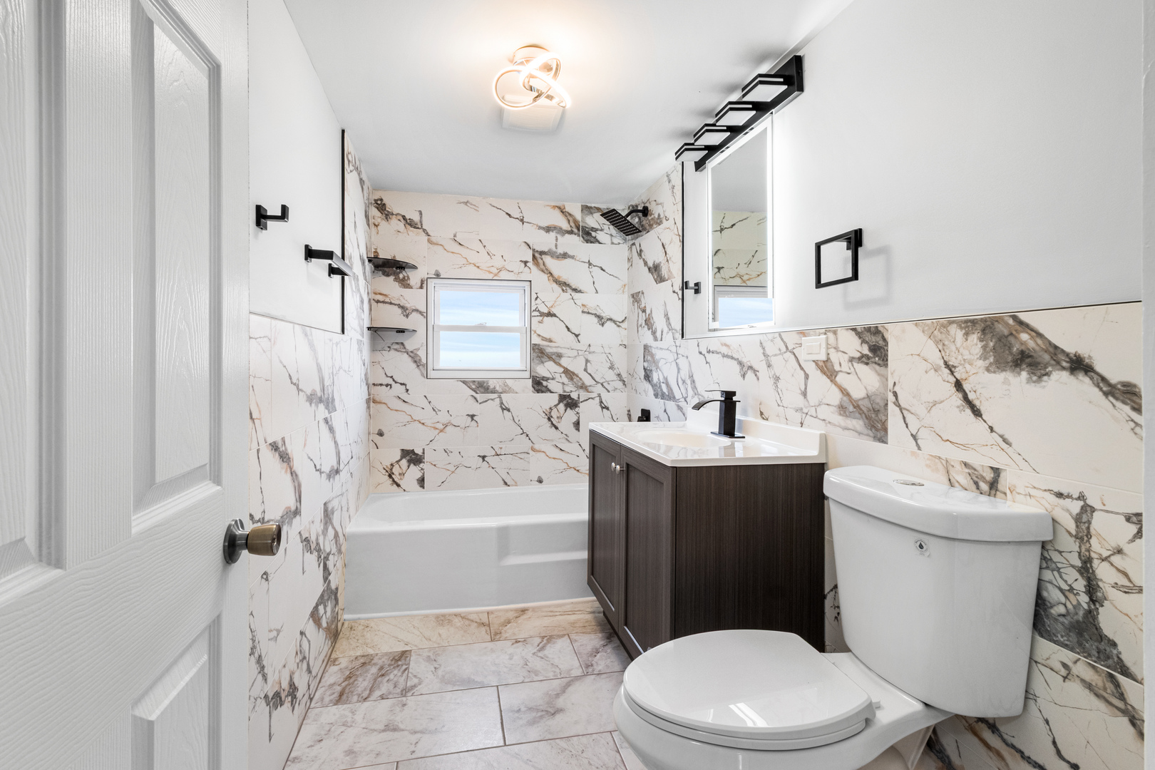 7424 57th Place Summit, IL 60501 - Photo 11 of 31 a bathroom with a sink a toilet and shower