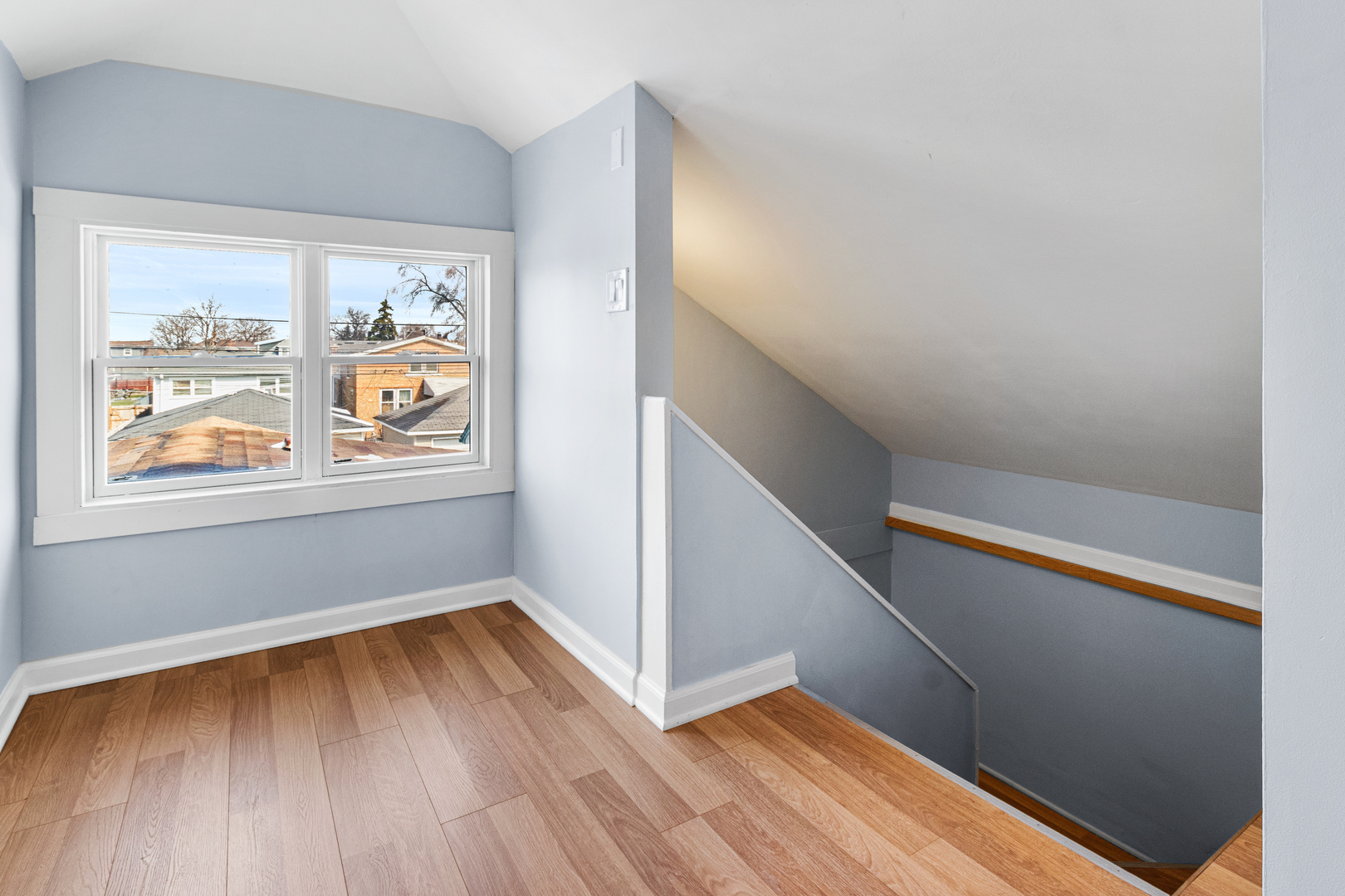 7424 57th Place Summit, IL 60501 - Photo 13 of 31 a view of hallway with window and wooden floor