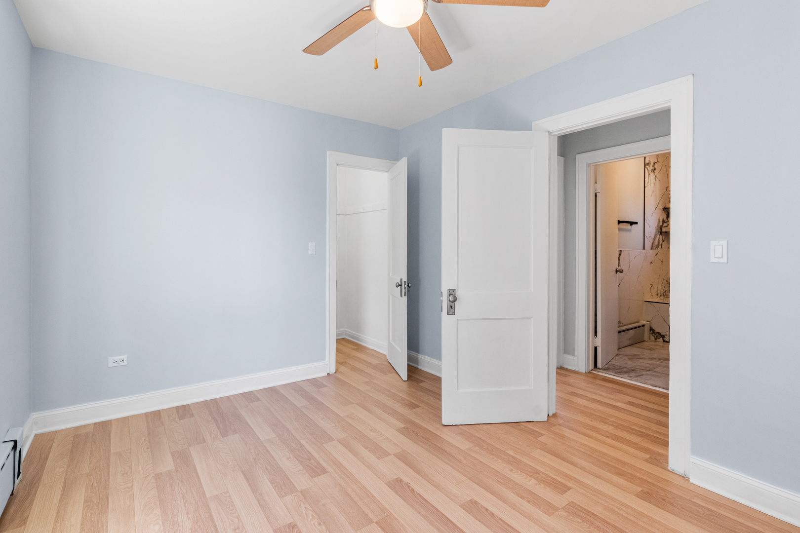 7424 57th Place Summit, IL 60501 - Photo 10 of 31 an empty room with wooden floor and closet