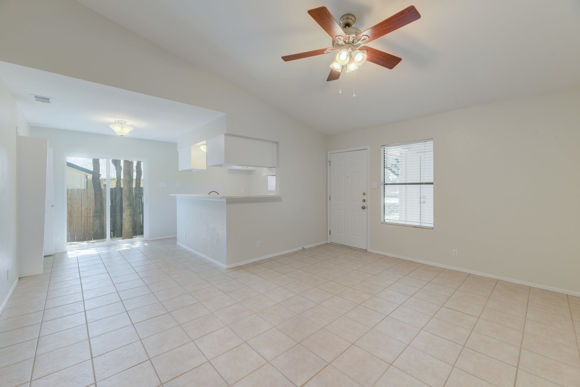 12603 Teague Trail, Unit B Austin, TX 78729 - Photo 4 of 14 a view of an empty room with a window