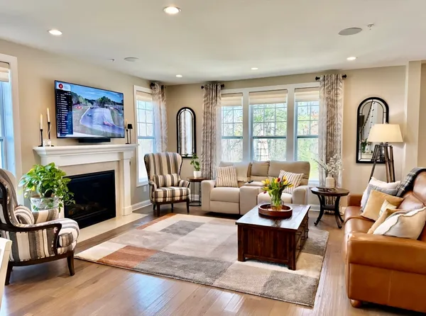 a kitchen with stainless steel appliances granite countertop a lot of cabinets and wooden floor