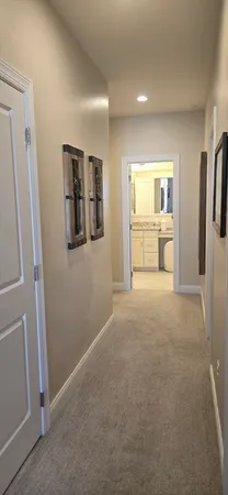 a white toilet sitting next to a bathroom sink