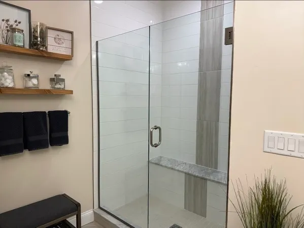 a bathroom with a toilet a sink and a mirror