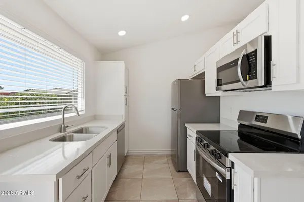 a kitchen with a sink and cabinets
