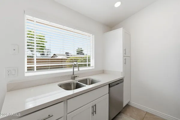 a view of a room with wooden floor and a window