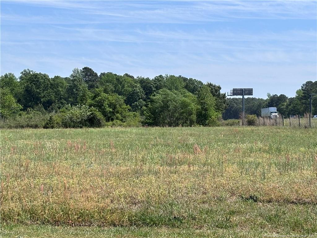 Backswamp Road Lumberton, NC 28360 - Photo 13 of 16 a view of a field with an trees
