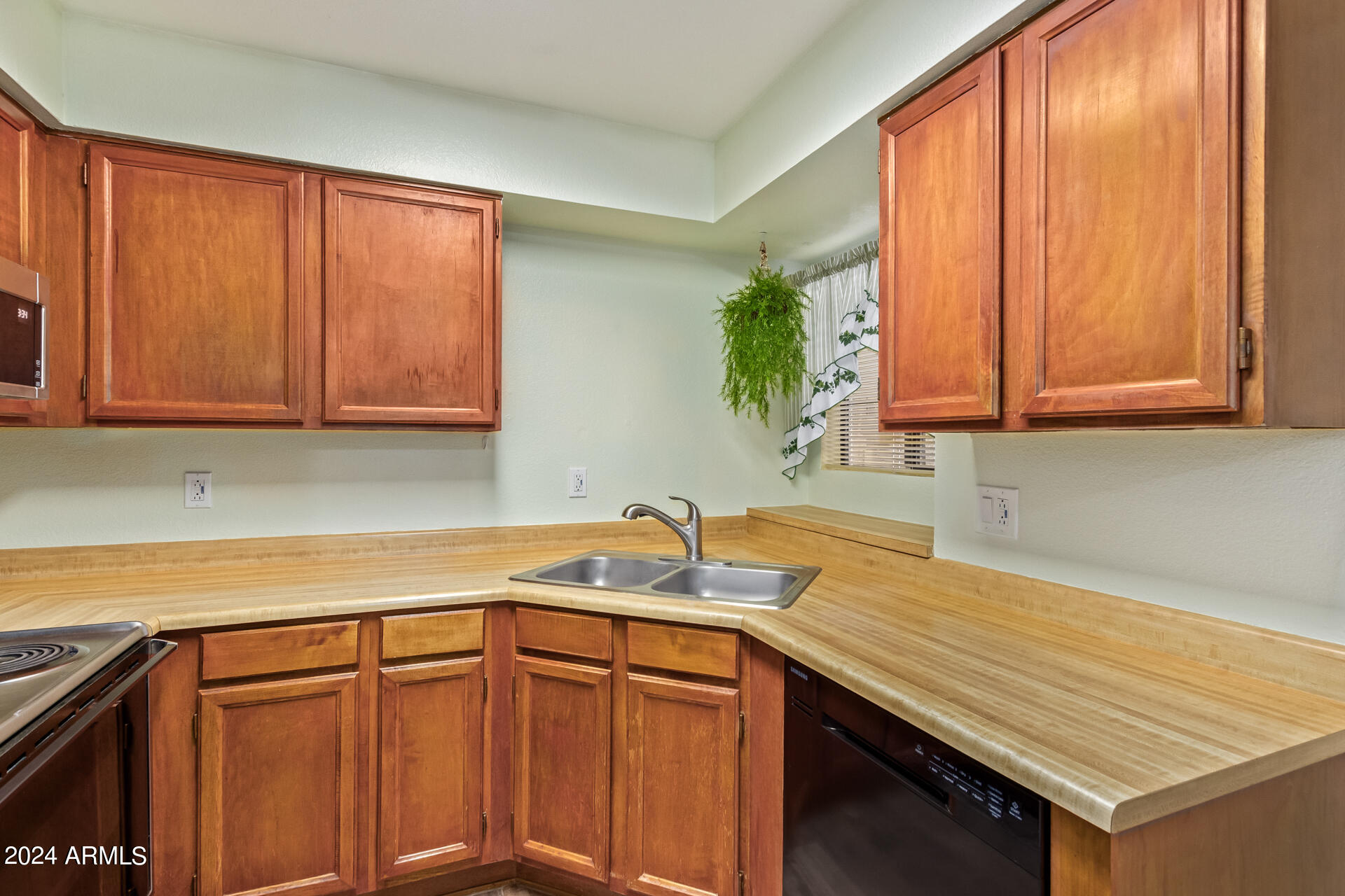 533 West Guadalupe Road, Unit 2046 Mesa, AZ 85210 - Photo 9 of 29 a kitchen with stainless steel appliances granite countertop wooden cabinets a sink and dishwasher
