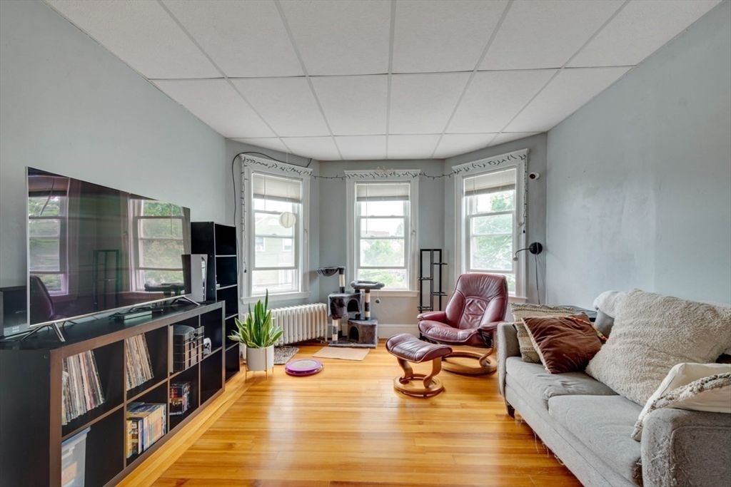 45 Jackson Road Somerville, MA 02145 - Photo 15 of 27 a living room with furniture and a flat screen tv
