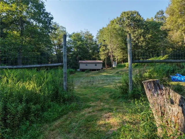 a view of a lake with a house in the background
