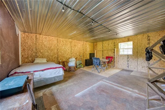 a view of a dining room with furniture and windows