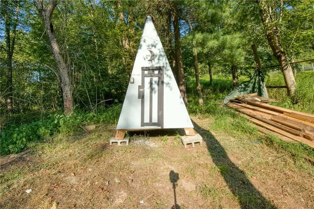 a bathroom with a toilet and shower