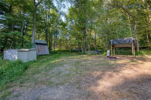 a view of backyard with green space