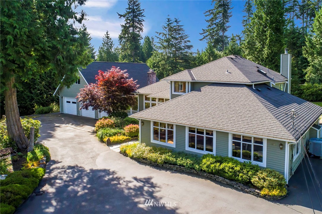 4826 200th Street Southeast Bothell, WA 98012 - Photo 1 of 40 a front view of a house with a yard and mountain view