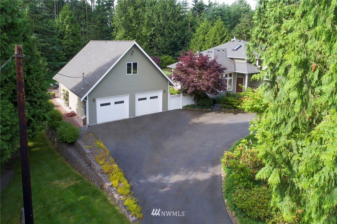 4826 200th Street Southeast Bothell, WA 98012 - Photo 3 of 40 a aerial view of a house with a yard and large trees