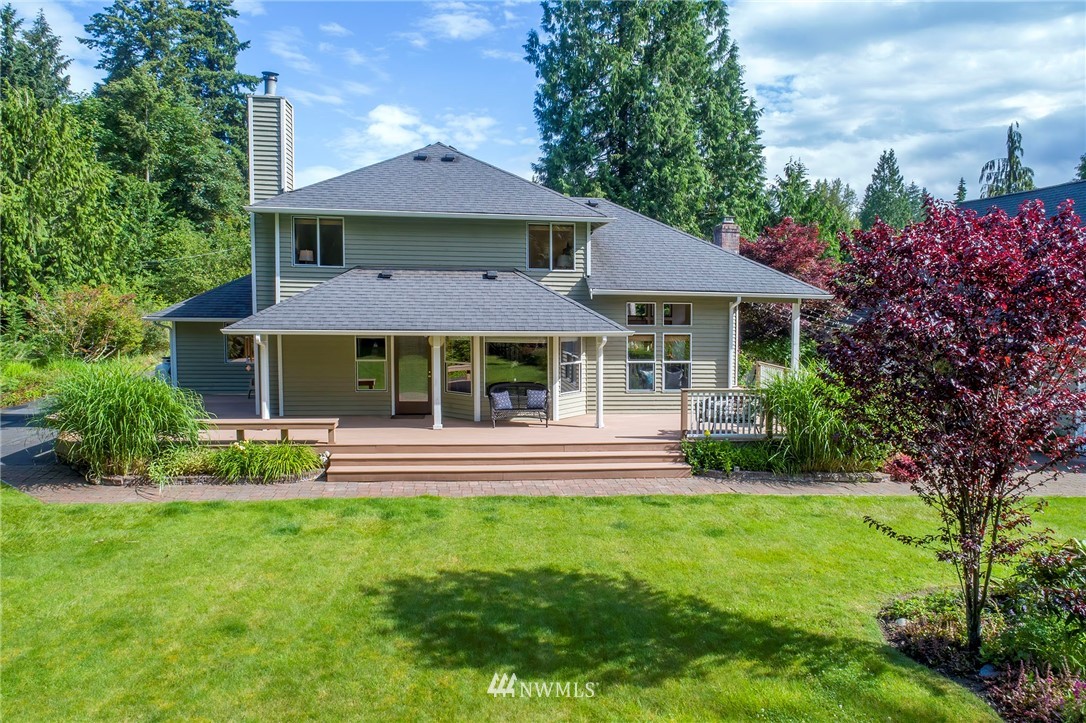 4826 200th Street Southeast Bothell, WA 98012 - Photo 33 of 40 a front view of a house with a yard table and chairs