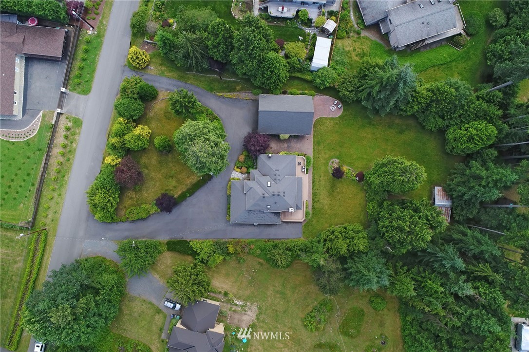 4826 200th Street Southeast Bothell, WA 98012 - Photo 36 of 40 an aerial view of a house with a garden and swimming pool