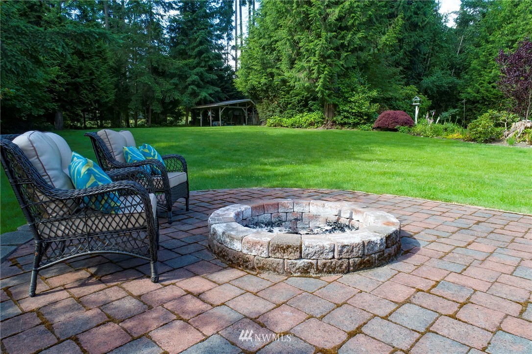 4826 200th Street Southeast Bothell, WA 98012 - Photo 6 of 40 a view of a chair and table in backyard of the house