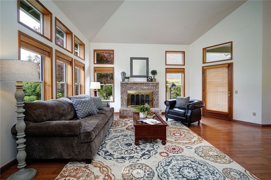 4826 200th Street Southeast Bothell, WA 98012 - Photo 8 of 40 a living room with furniture fireplace and a window