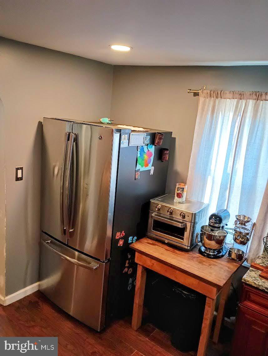 219 Front Street Fieldsboro, NJ 08505 - Photo 17 of 48 a view of a refrigerator with wooden floor