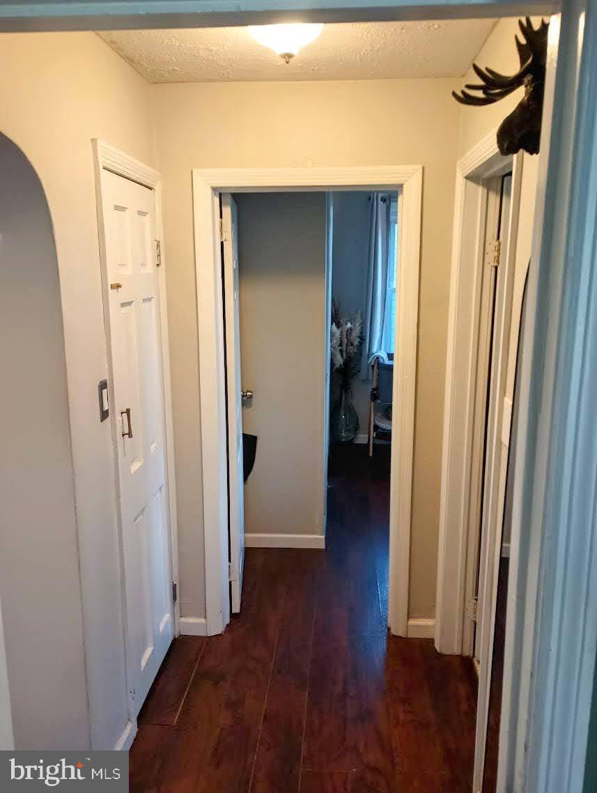 219 Front Street Fieldsboro, NJ 08505 - Photo 19 of 48 a view of a hallway with wooden floor and closet