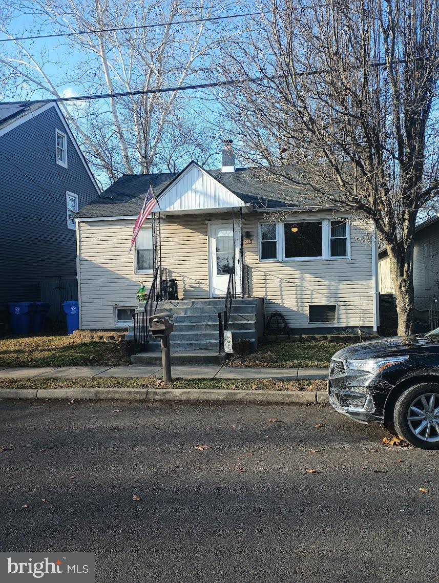 219 Front Street Fieldsboro, NJ 08505 - Photo 2 of 48 a view of a house with a cars park side of a road