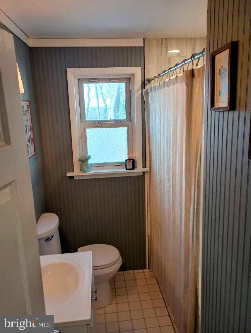 219 Front Street Fieldsboro, NJ 08505 - Photo 25 of 48 a bathroom with a toilet a sink and shower